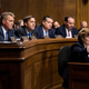 Rachel Mitchell, counsel for Senate judiciary committee Republicans, questions Ford as GOP senators Mike Crapo, Jeff Flake, Ben Sasse, Ted Cruz, Mike Lee and John Cornyn look on.